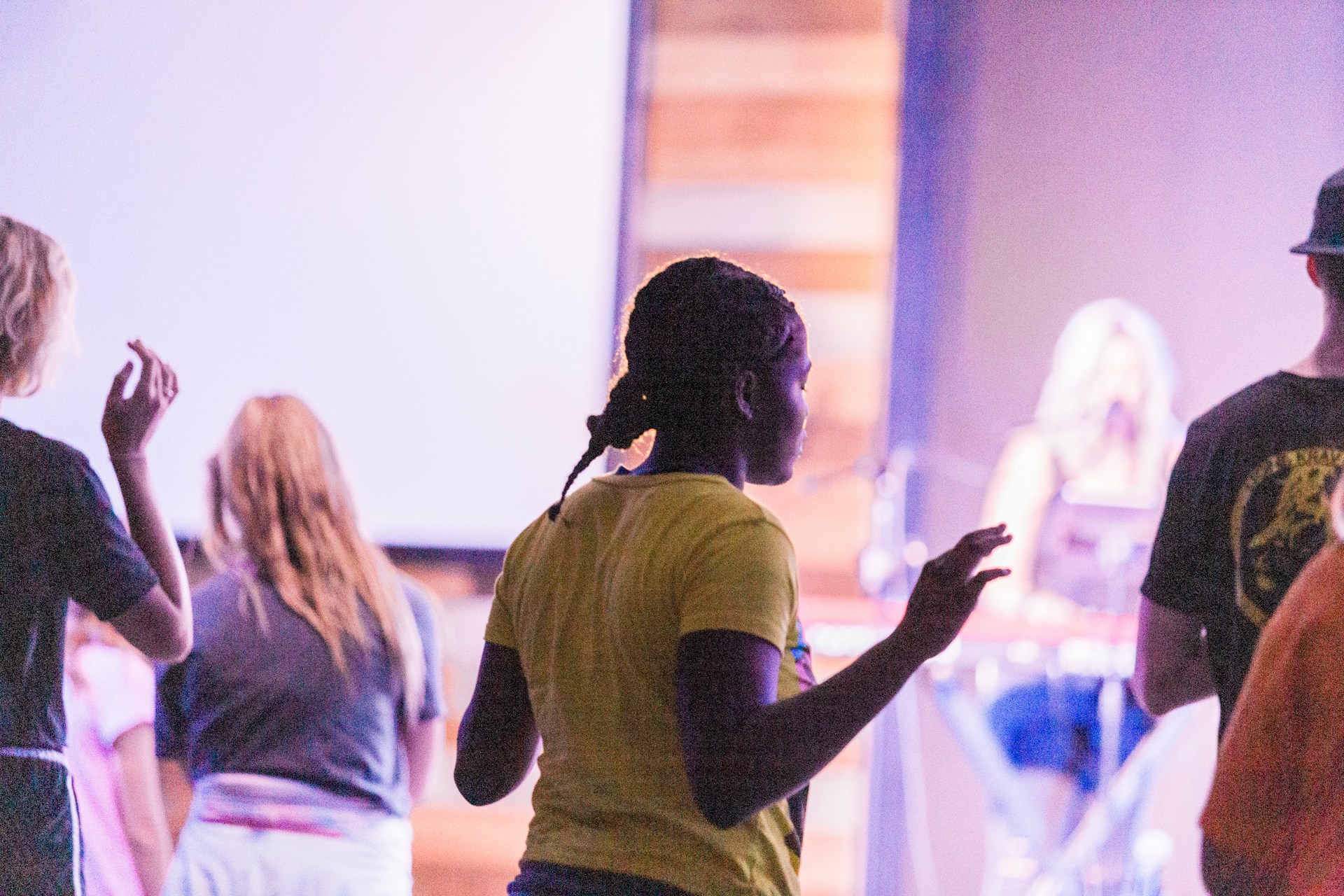 Diverse youth collaborating inside the Forward Youth Foundation community studio in Omaha